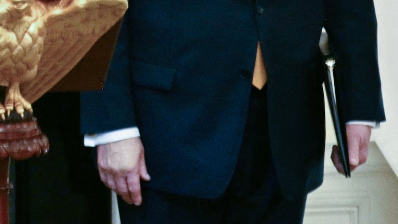 Japan's Prime Minister Sanae Takaichi speaks while US President Donald Trump looks on during a dinner in the State Dining Room of the White House in Washington on March 19, 2026.