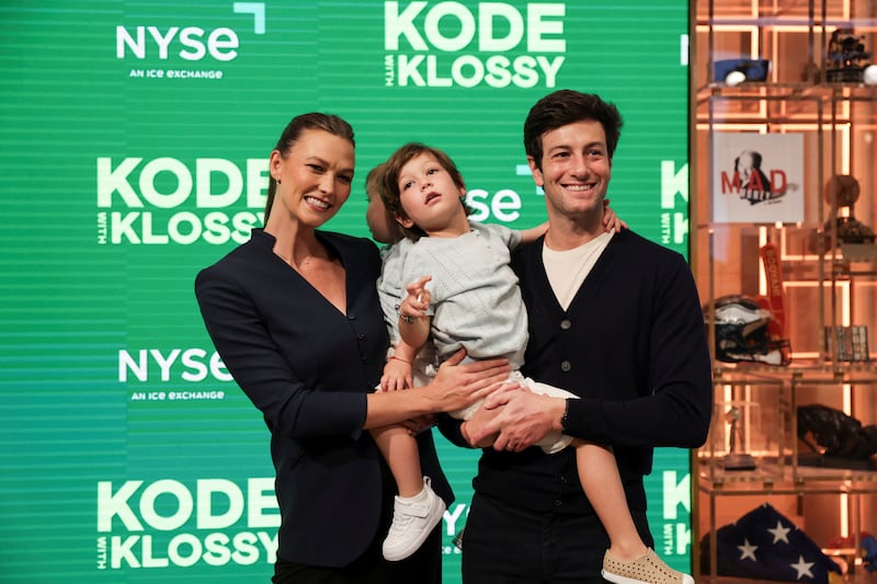 Karlie Kloss, founder of Kode With Klossy, poses for pictures with her husband Joshua Kushner and their children Levi Joseph and Elijah Jude at the New York Stock Exchange (NYSE) in New York City, U.S., July 7, 2025.