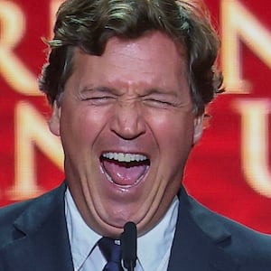 Political commentator Tucker Carlson speaks during the memorial service for political activist Charlie Kirk at State Farm Stadium on September 21,