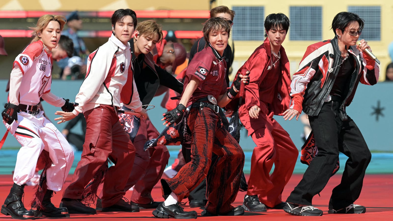 Members of the South Korean boy band BTS perform during the 2026 World Cup football tournament final match between Spain and Argentina.