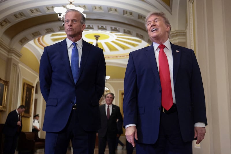 U.S. President Donald Trump speaks with the press while walking with Senate Majority Leader John Thune (R-SD), to the Senate Republican Steering Committee lunch at the U.S. Capitol, in Washington, D.C., U.S., June 24, 2026.