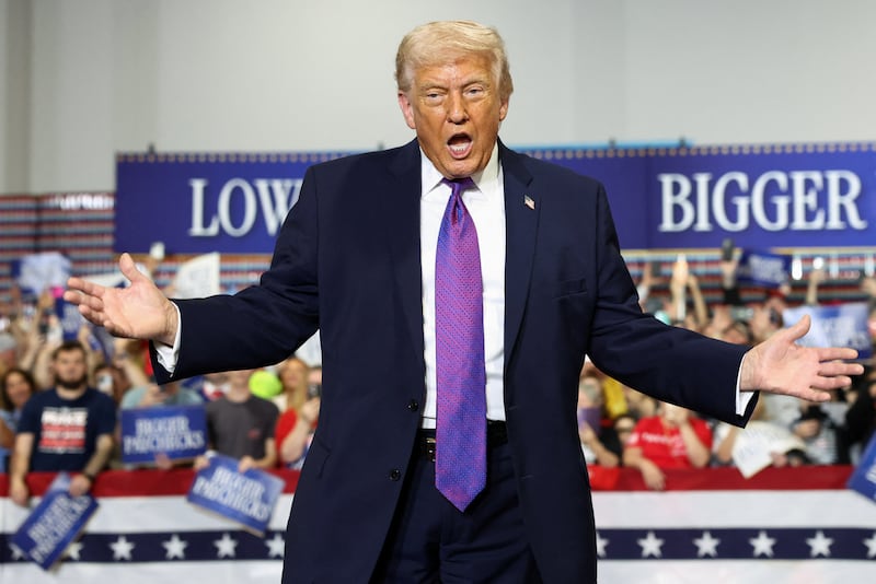 U.S. President Donald Trump gestures during a visit to Verst Logistics in Hebron, Kentucky, U.S., March 11, 2026.