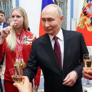 Russia's President Vladimir Putin toasts with members of the Russian Paralympic team, who took part in the 2026 Winter Paralympics in Italy, during an awarding ceremony at the Kremlin in Moscow, Russia, March 19, 2026.