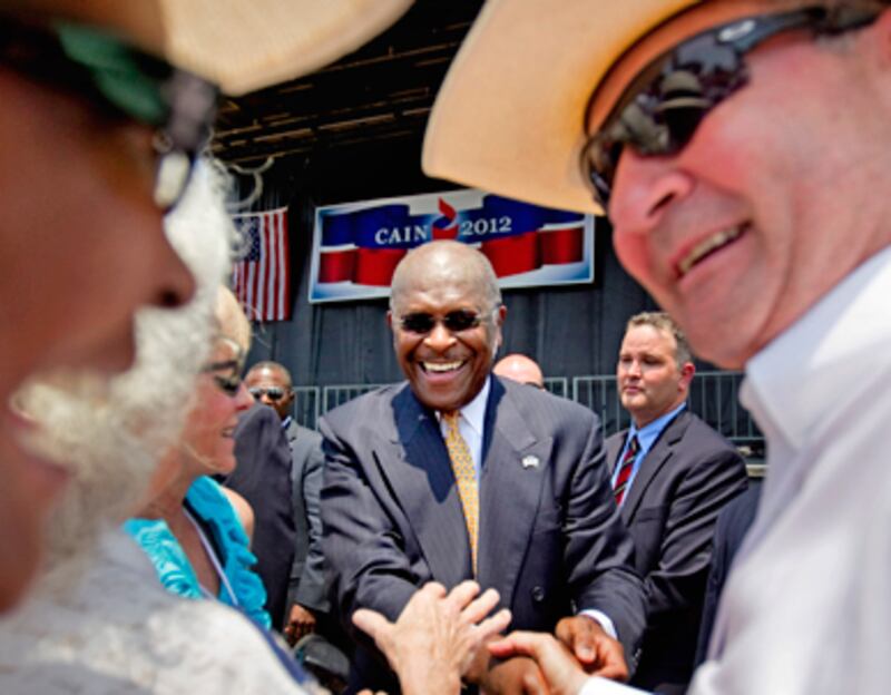 articles/2011/05/21/herman-cain-can-the-pizza-guy-win-it-for-the-tea-party/mckinnon-cain_182311_buxuow