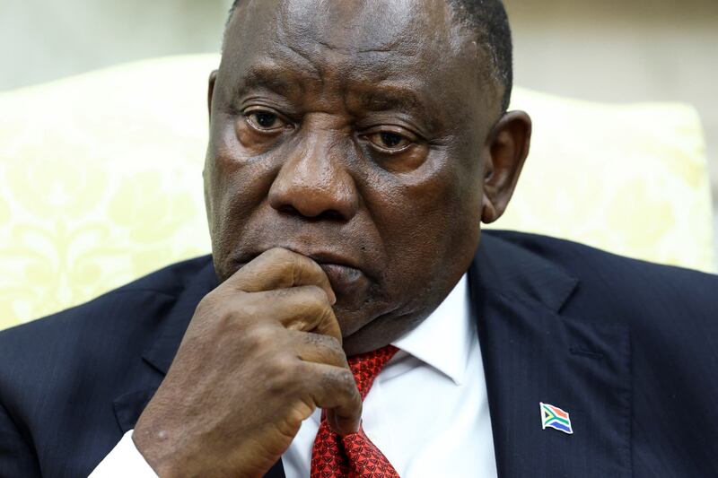 South African President Cyril Ramaphosa looks on as he meets U.S. President Donald Trump in the Oval Office of the White House in Washington, D.C., U.S., May 21, 2025.