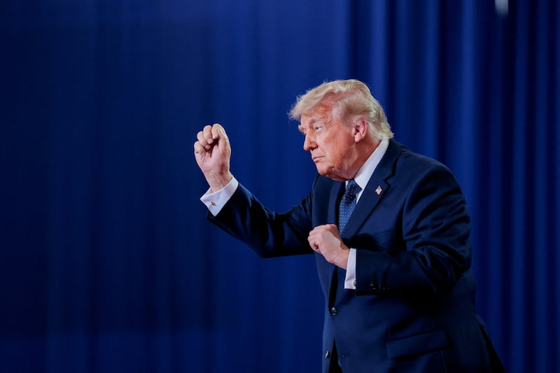 U.S. President Donald Trump reacts on the stage on the day of delivering remarks at Rockland Community College in Suffern, New York, U.S., May 22, 2026.