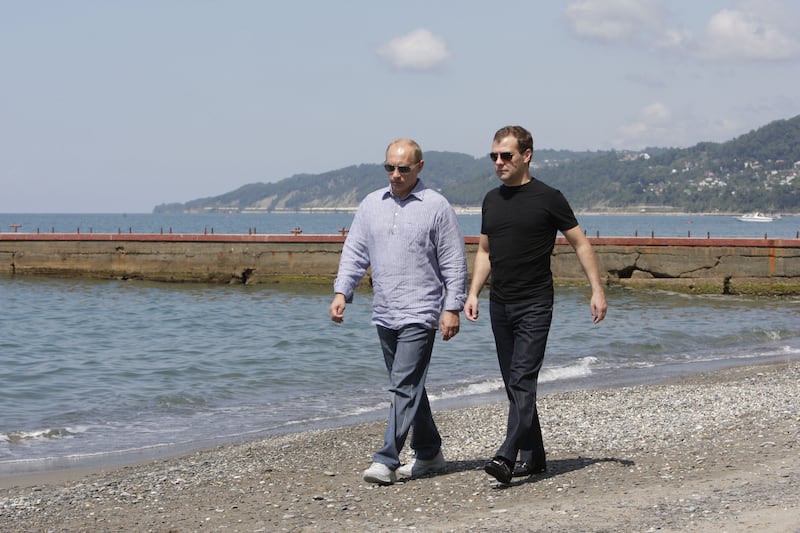 Putin and Dmitry Medvedev, the deputy chairman of the Security Council of Russia, on the beach in the territory of the presidential residence in Sochi, back when Medvedev was president and Putin was prime minister.