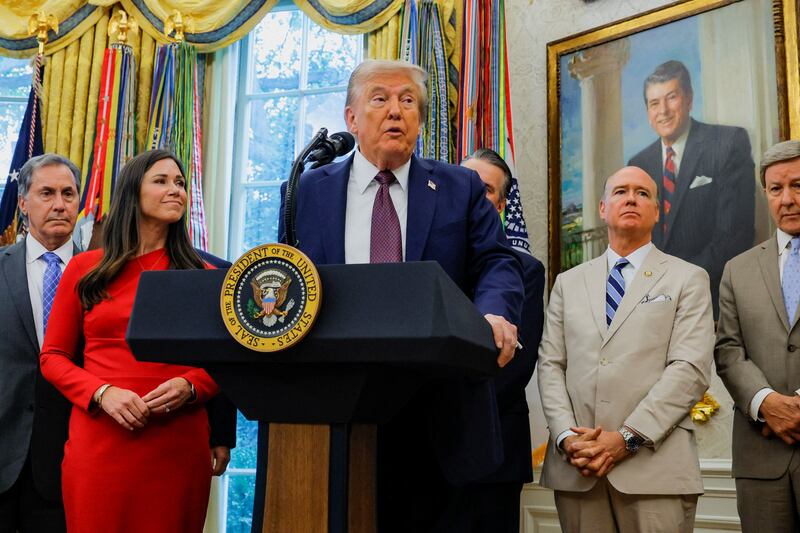 U.S. President Donald Trump, flanked by Representative Gary Palmer (R-AL), Senator Katie Britt (R-AL), Representative Robert Aderholt (R-AL) and Representative Mike Rogers (R-AL) speaks during an event to announce that the Space Force Command will move from Colorado to Alabama, in the Oval Office at the White House in Washington, D.C., U.S., September 2, 2025. REUTERS