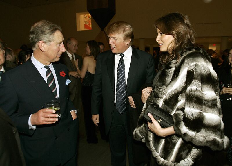 Prince Charles talks with Donald and Melania Trump at a reception at the Museum of Modern Art in 2005.