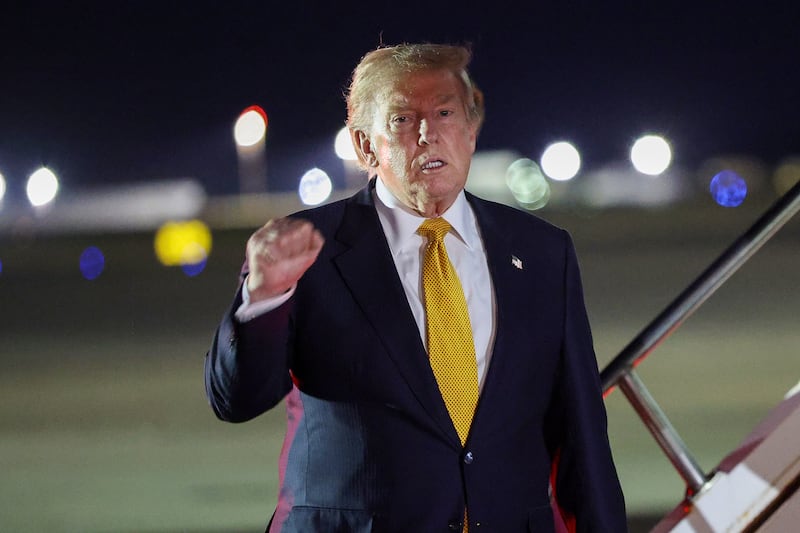 MILDENHALL, ENGLAND - JULY 08: U.S. President Donald Trump gestures as he steps off Air Force One to board the new Qatari-gifted Boeing plane, enroute to the United States following his participation in the NATO Summit at Royal Air Force Mildenhall on July 08, 2026 in Mildenhall, England. According to Trump, he departed the NATO Summit in Turkey onboard the previous Air Force One aircraft to allow U.S. service members stationed at RAF Mildenhall to tour the new Qatari-gifted Air Force One. (Photo by Win McNamee/Getty Images)