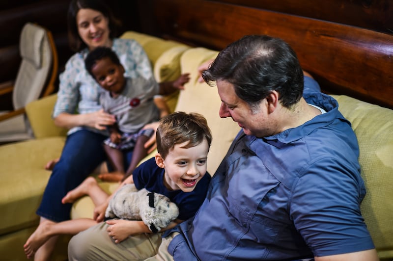 Episcopal priest James Isaacs, 40, photographed with his wife Maggie Brewinski Isaacs, 40, and their children Jimmy Isaacs, 4, center, and Joseph Isaacs, 2.