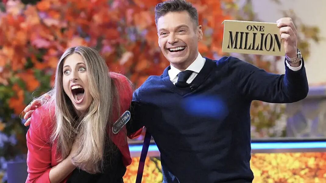 Wheel of Fortune contestant Christina Derevjanik and host Ryan Seacrest.