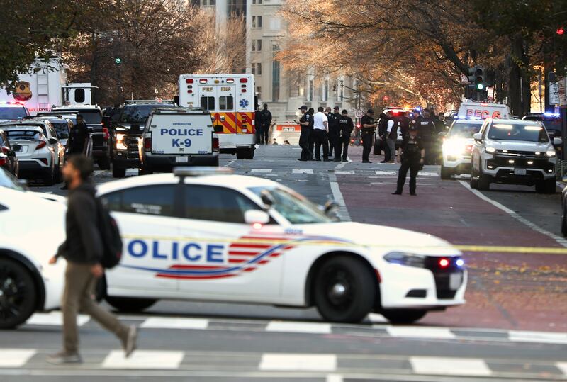 Members of the U.S. Secret Service and other law enforcement agencies respond to a shooting near the White House
