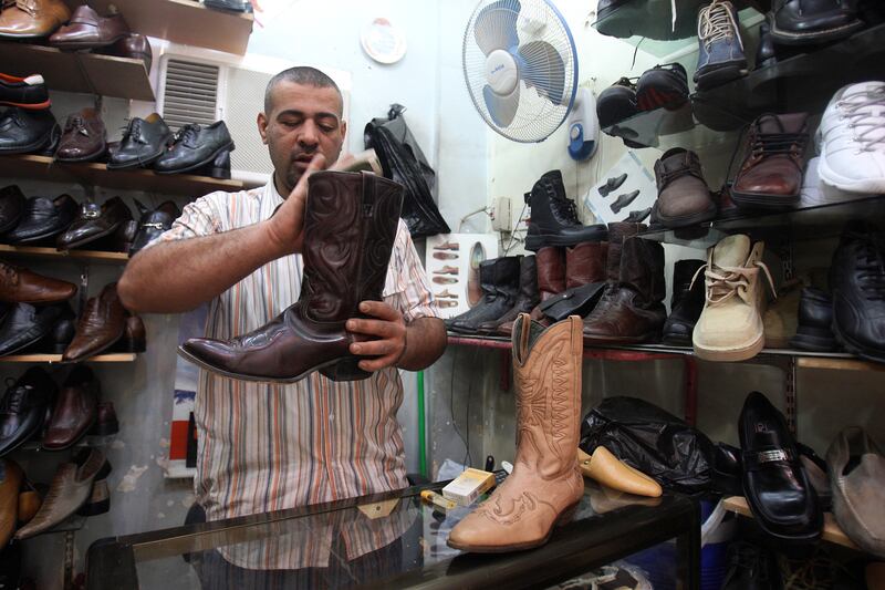 galleries/2013/04/04/man-heels-a-short-history/130403-man-heels-cowboy-boots-iraq_wxgz9b