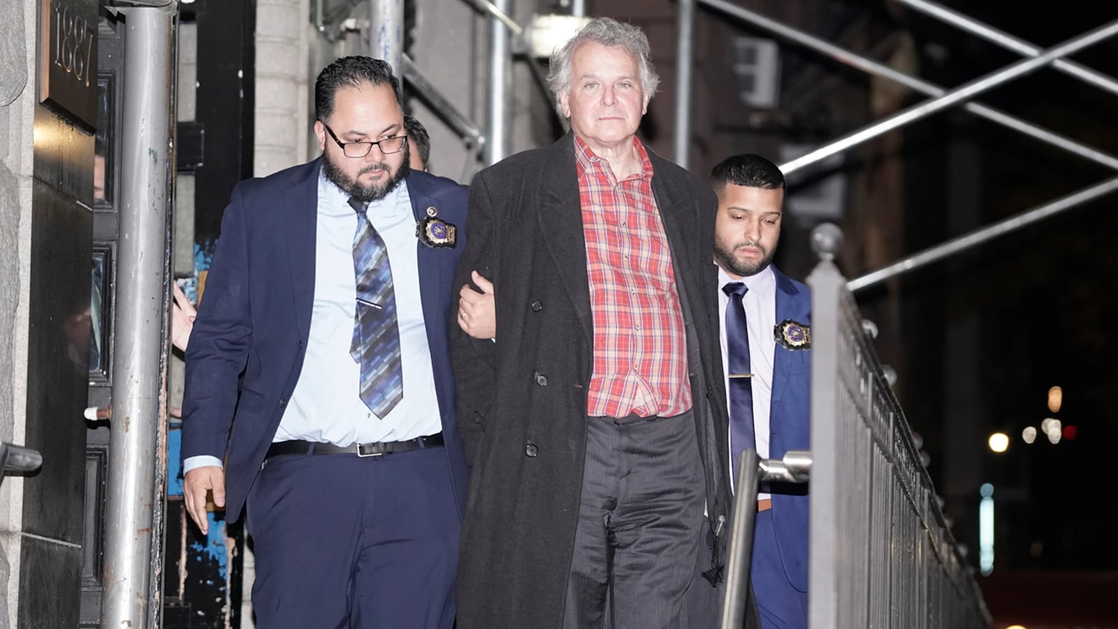 "Barry Williams for New York Daily News Stuart Seldowitz is walked from the 19th Pct. Wednesday, Nov. 22, in Manhattan, New York.