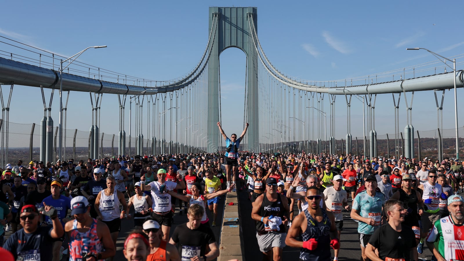 Runners cross the Verrazano Bridge as they compete in the New York Marathon in New York on November 2, 2025.