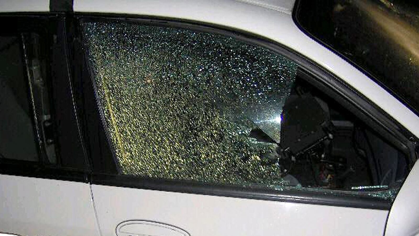 cheats/2012/04/10/cop-car-shot-up-near-trayvon-site/sanford-police-car-shoot-cheat_xzhur5