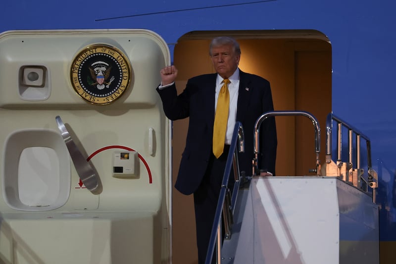 U.S. President Donald Trump disembarks Air Force One as he arrives at Haneda Airport on October 27, 2025 in Tokyo, Japan.