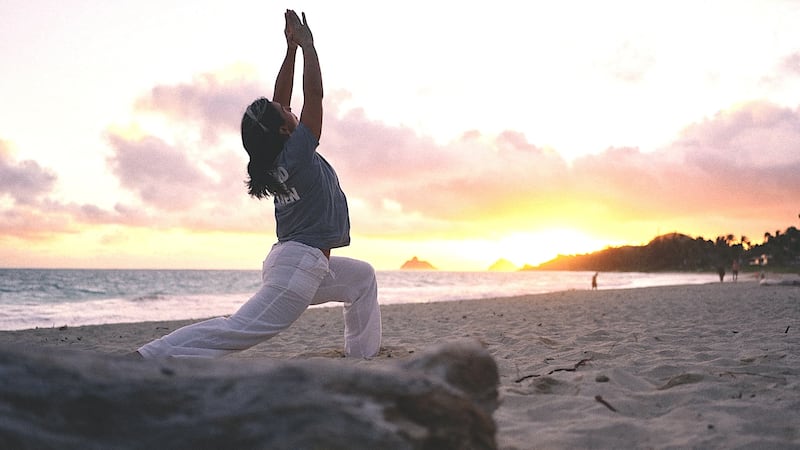 Tulsi Gabbard does some New Year beach yoga as her boss plotted to invade Venezuela.