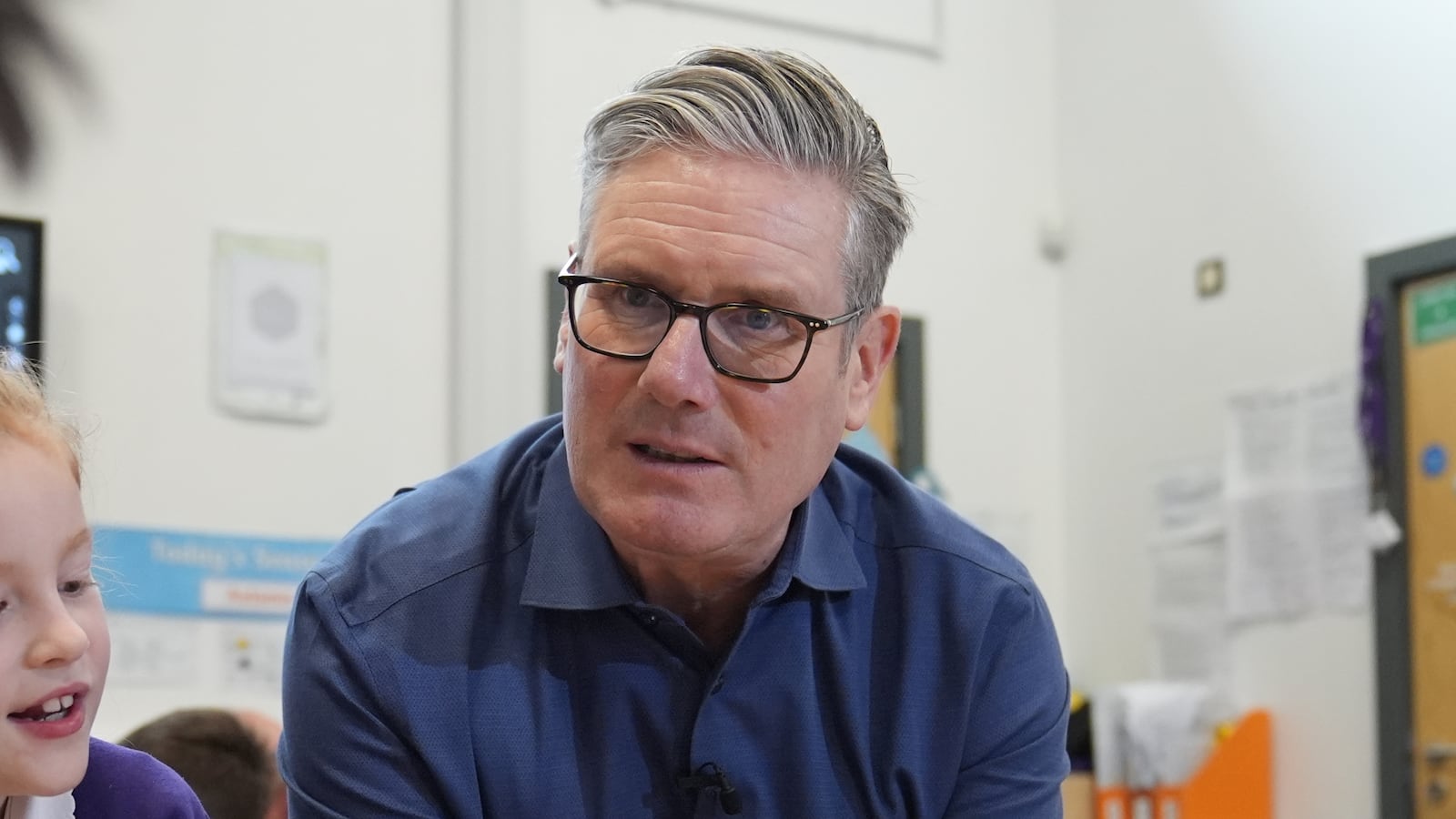 PETERBOROUGH, UNITED KINGDOM - NOVEMBER 24: Prime Minister Sir Keir Starmer reads with pupils during a visit to Welland Academy on November 24, 2025 in Peterborough, England. The Prime Minister is visiting the school in Cambridgeshire to highlight the importance of the Free School Meals program, and the government's efforts to address the cost of living crisis. (Photo by Joe Giddens - WPA Pool / Getty Images)