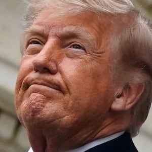 U.S. President Donald Trump looks on as he delivers remarks in the Memorial Amphitheater during a Memorial Day event at Arlington National Cemetery, Arlington, Virginia, U.S., May 25, 2026. REUTERS/Nathan Howard