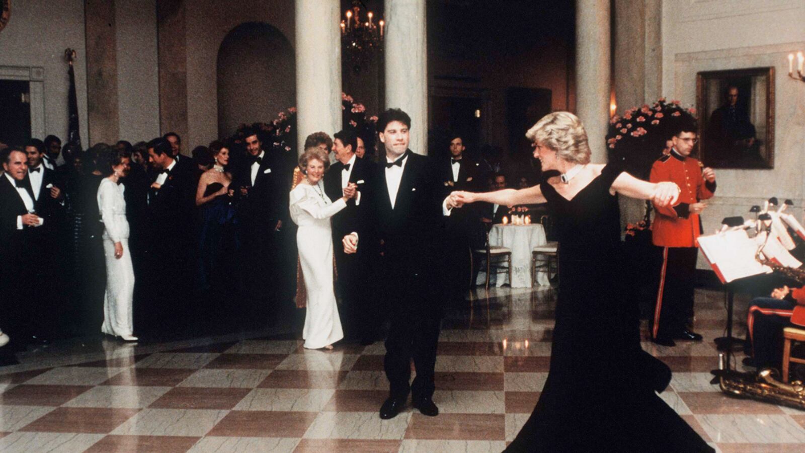 articles/2013/03/20/princess-diana-s-fabulous-dresses-sell-for-1-2m/diana-travolta_tgojm2