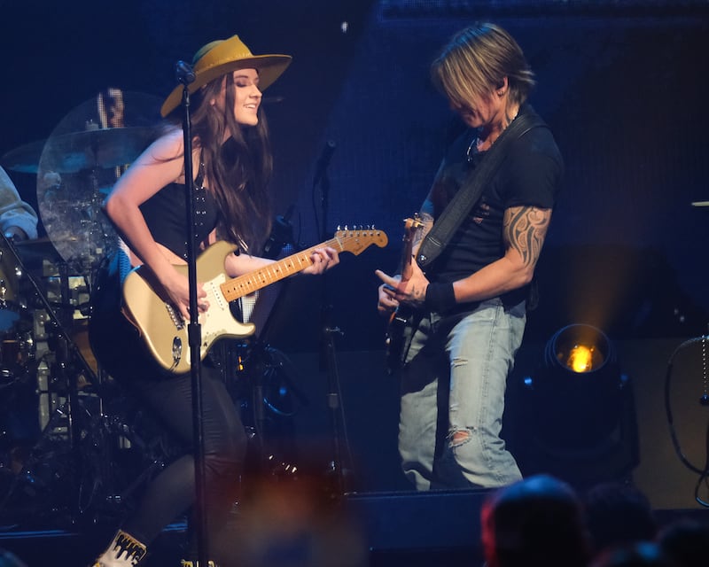 AUSTIN, TEXAS - MAY 04: (L-R) Maggie Baugh and Keith Urban perform onstage at the 2024 iHeartCountry Festival - Show at Moody Center on May 04, 2024 in Austin, Texas.