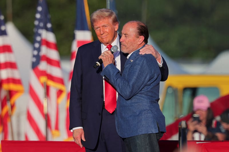 Lee Greenwood speaks next to Republican presidential nominee former U.S. president Donald Trump at a rally as Trump returns to the site of the July assassination attempt against him in Butler, Pennsylvania, U.S., October 5, 2024.
