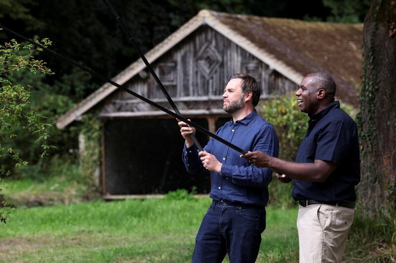 U.S. Vice President JD Vance fishes with British Foreign Secretary David Lammy at Chevening House in Sevenoaks, Britain, August 8, 2025. REUTERS/Suzanne Plunkett/Pool