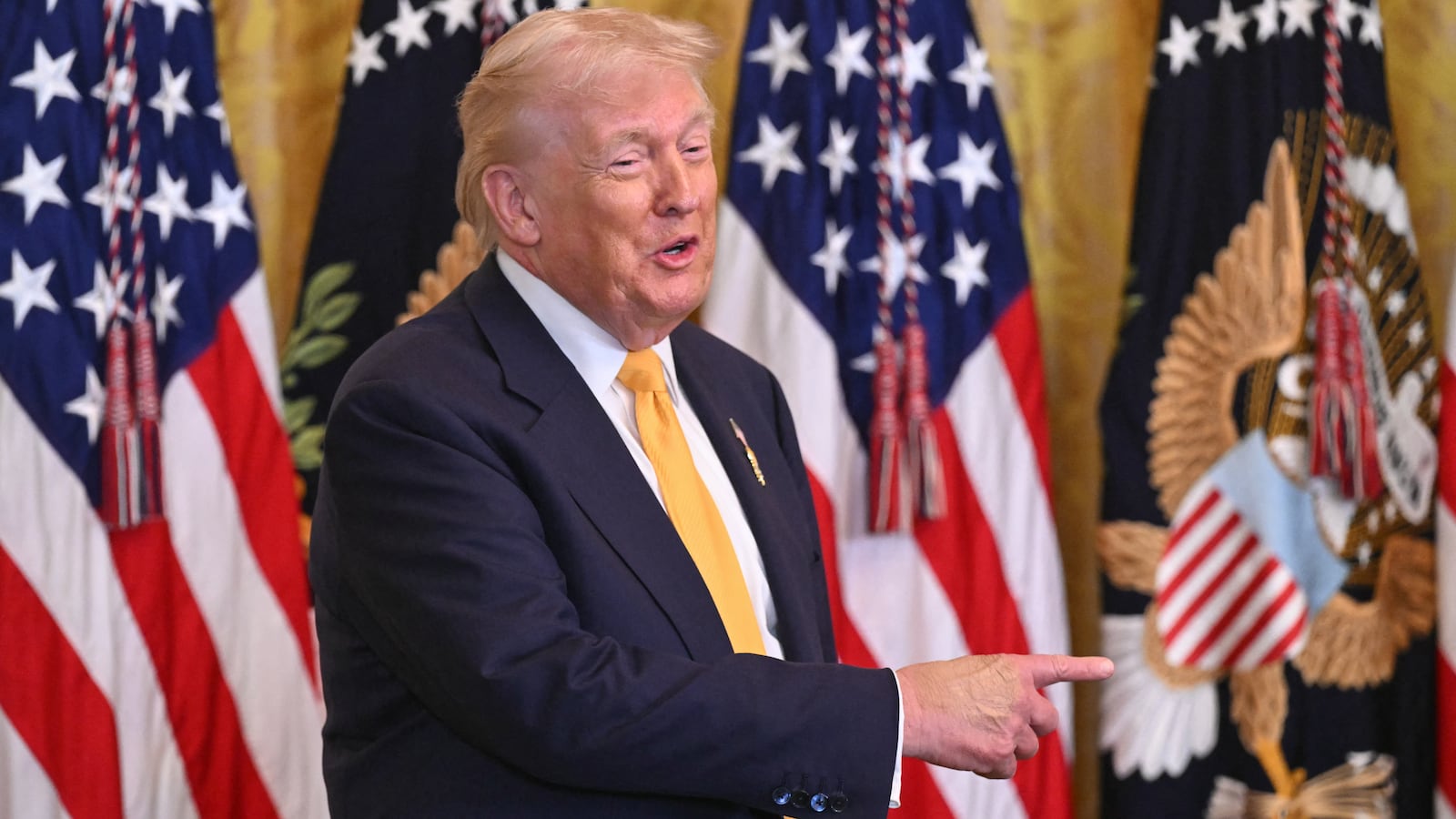 US President Donald Trump gestures as he speaks during a Black History Month event in the East Room of the White House in Washington, DC, on February 18, 2026. (Photo by SAUL LOEB / AFP via Getty Images)