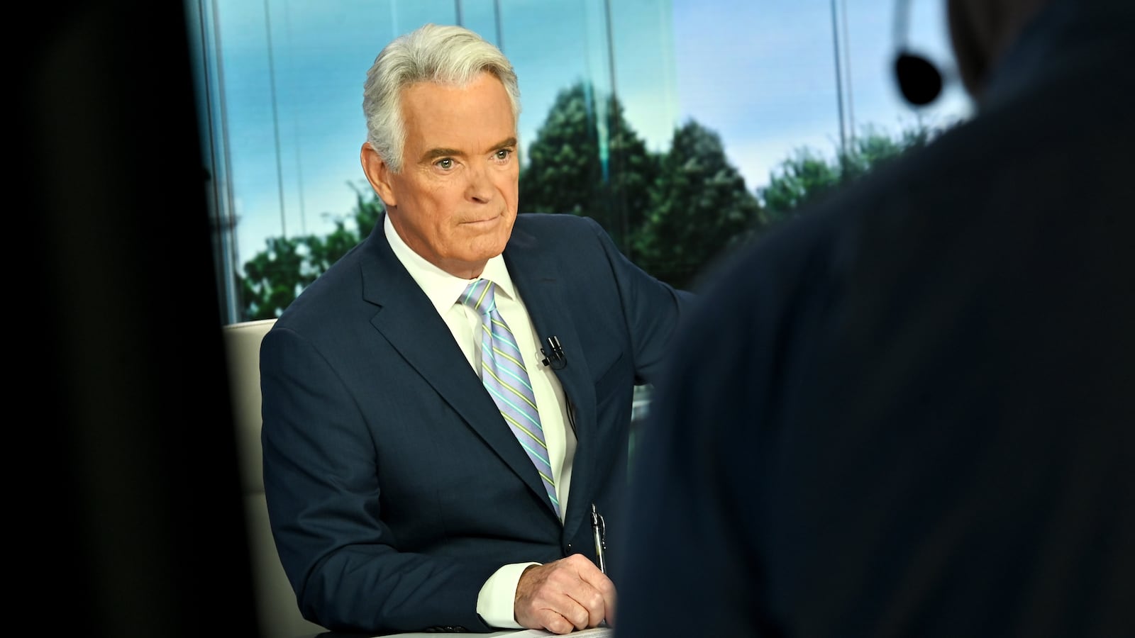 WASHINGTON, DC - OCTOBER 19: Host John Roberts prepares for an interview on the set of "America Reports" at FOX News D.C. Bureau on October 19, 2022 in Washington, DC.