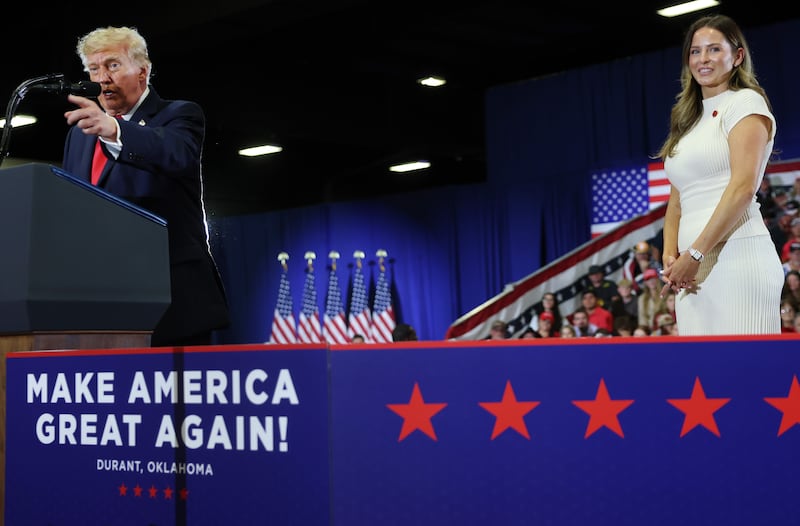 U.S. President Donald Trump (L) speaks as Special Assistant to the President and Communications Advisor Margo Martin stands by during a campaign rally with Oklahoma Republican gubernatorial candidate Mike Mazzei at the Choctaw Event Center on October 01, 2026 in Durant, Oklahoma.