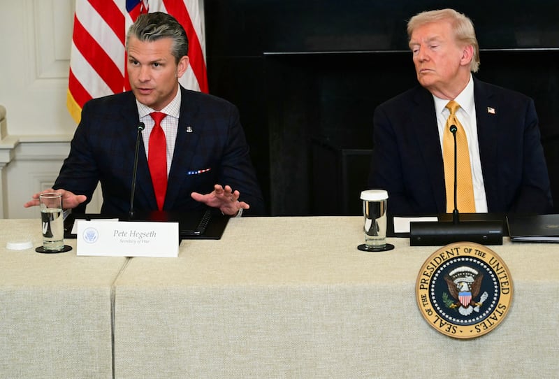US President Donald Trump listens to Defense Secretary Pete Hegseth during a law enforcement roundtable in the State Dining Room
