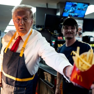 Donald Trump works behind the counter at McDonald's.