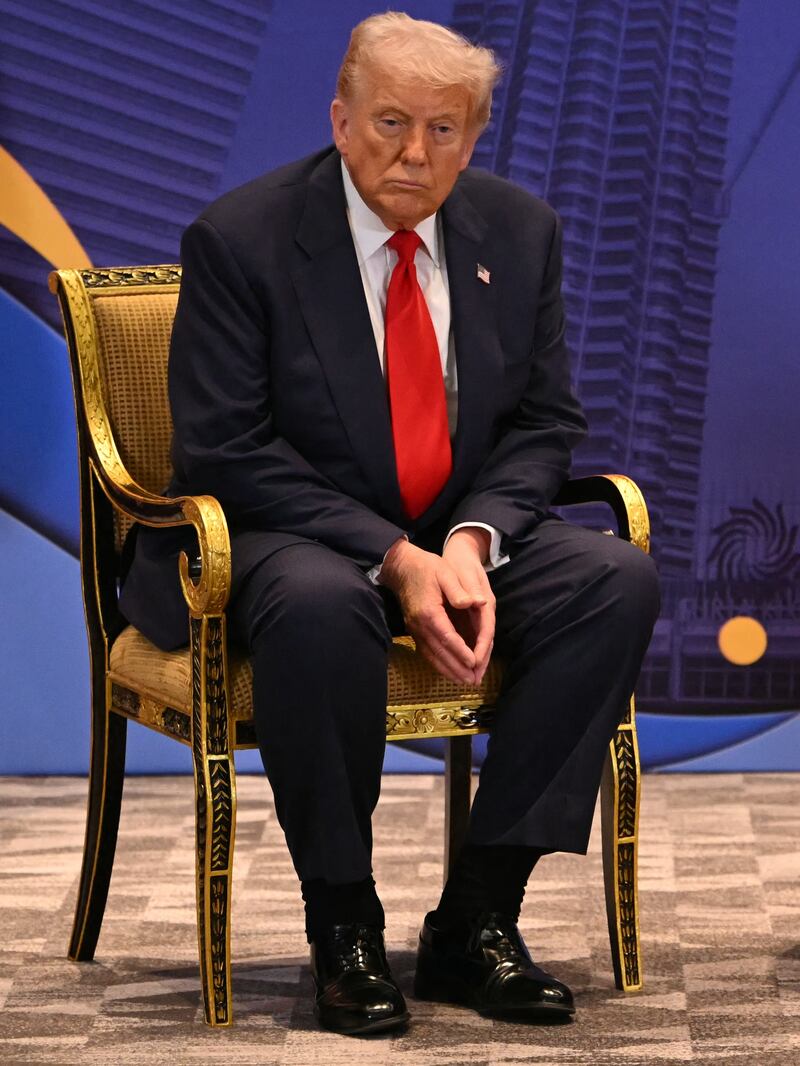 US President Donald Trump (L) looks on as Malaysia's Prime Minister Anwar Ibrahim (R) speaks during a bilateral meeting on the sidelines of the 47th Association of Southeast Asian Nations (ASEAN) Summit in Kuala Lumpur on October 26, 2025. (Photo by ANDREW CABALLERO-REYNOLDS / AFP) (Photo by ANDREW CABALLERO-REYNOLDS/AFP via Getty Images)