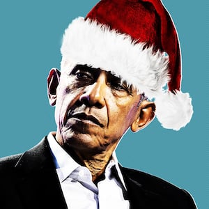 Barack Obama wearing a Santa hat.