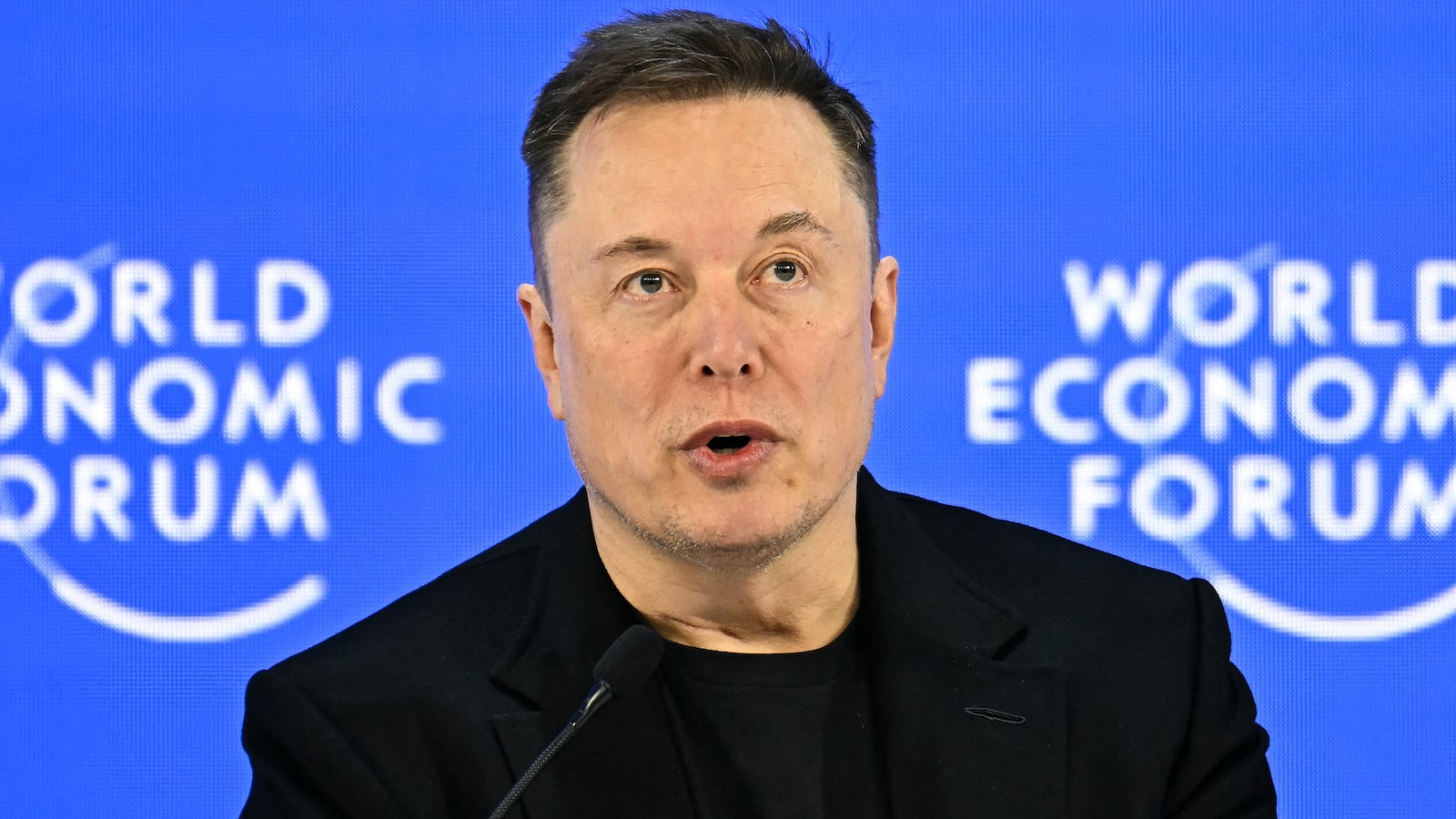 CEO of SpaceX and Tesla, South African-Canadian-US businessman Elon Musk speaks during the World Economic Forum (WEF) annual meeting in Davos on January 22, 2026. The World Economic Forum takes place in Davos from January 19 to January 23, 2026. (Photo by Fabrice COFFRINI / AFP via Getty Images)