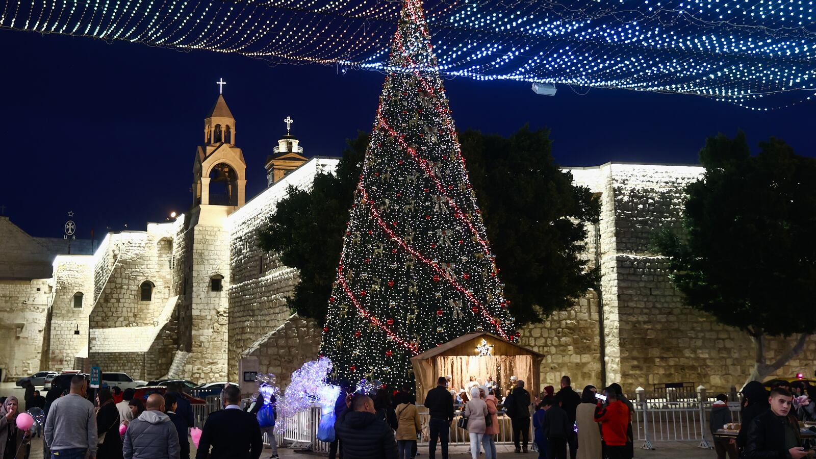 View of the Basilica of the Nativity and a Christmas tree in Bethlehem