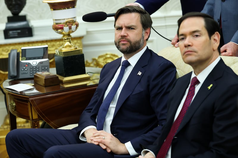 WASHINGTON, DC - OCTOBER 07: U.S. Vice President JD Vance (C) and U.S. Secretary of State Marco Rubio look on during a meeting between U.S. President Donald Trump and Canadian Prime Minister Mark Carney in the Oval Office of the White House on October 07, 2025 in Washington, DC. Carney visited the White House earlier in the year after he was elected prime minister. Carney and Trump will meet in the Oval Office and later have a bilateral lunch where they are expected to discuss a range of topics including U.S. tariffs. (Photo by Anna Moneymaker/Getty Images)