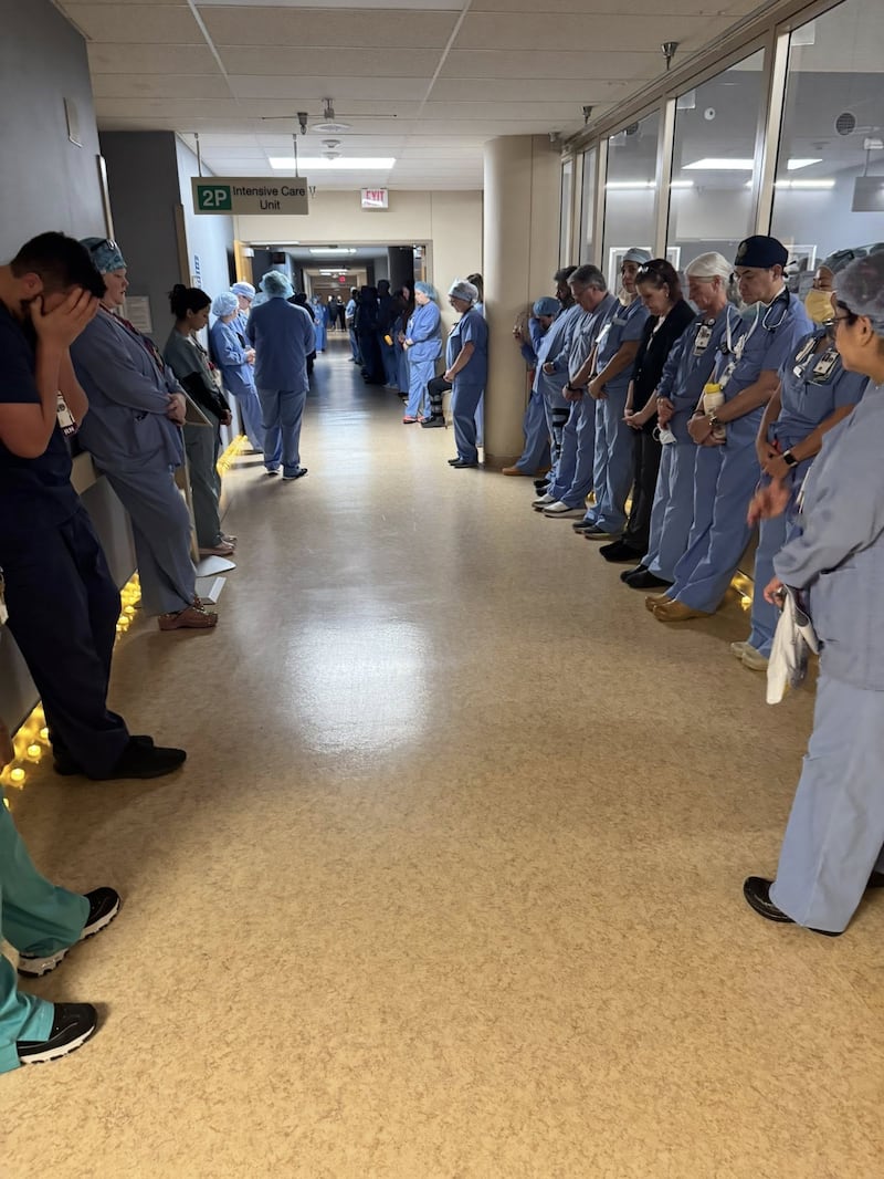 Alex Pretti's colleagues hold a moment a moment of silence at Minneapolis VA Health Care System hospital, in Minneapolis, Minnesota.
