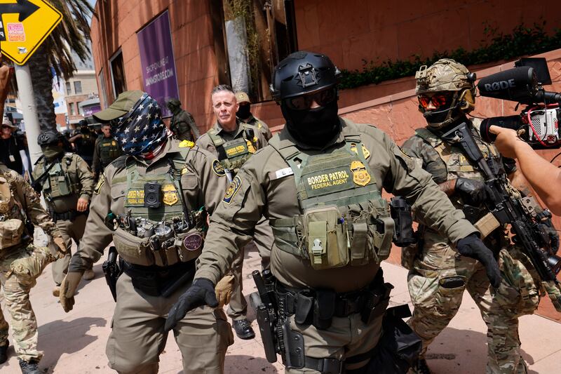 Gregory Bovino, Chief Patrol Agent of the El Centro Sector and Commander-Operation At Large CA (center), marches with federal agents