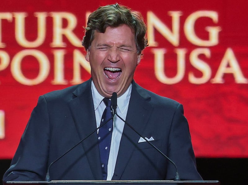 Political commentator Tucker Carlson speaks during the memorial service for political activist Charlie Kirk at State Farm Stadium on September 21,