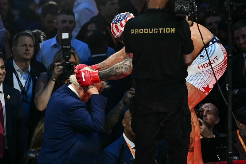 President Donald Trump interacts with America's Josh Hokit during the "UFC Freedom 250" mixed martial arts event on the South Lawn of the White House in Washington, DC, June 14, 2026.