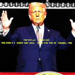 Donald Trump standing on a balcony at the Kennedy Center with the new name -- The Donald J. Trump John F. Kennedy Memorial Center for the Performing Arts