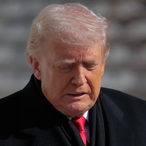 U.S. President Donald Trump walks out of the White House as he departs on January 27, 2026 in Washington, DC.