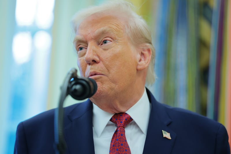 President Donald Trump speaks to reporters in the Oval Office of the White House on December 15, 2025 in Washington, DC.