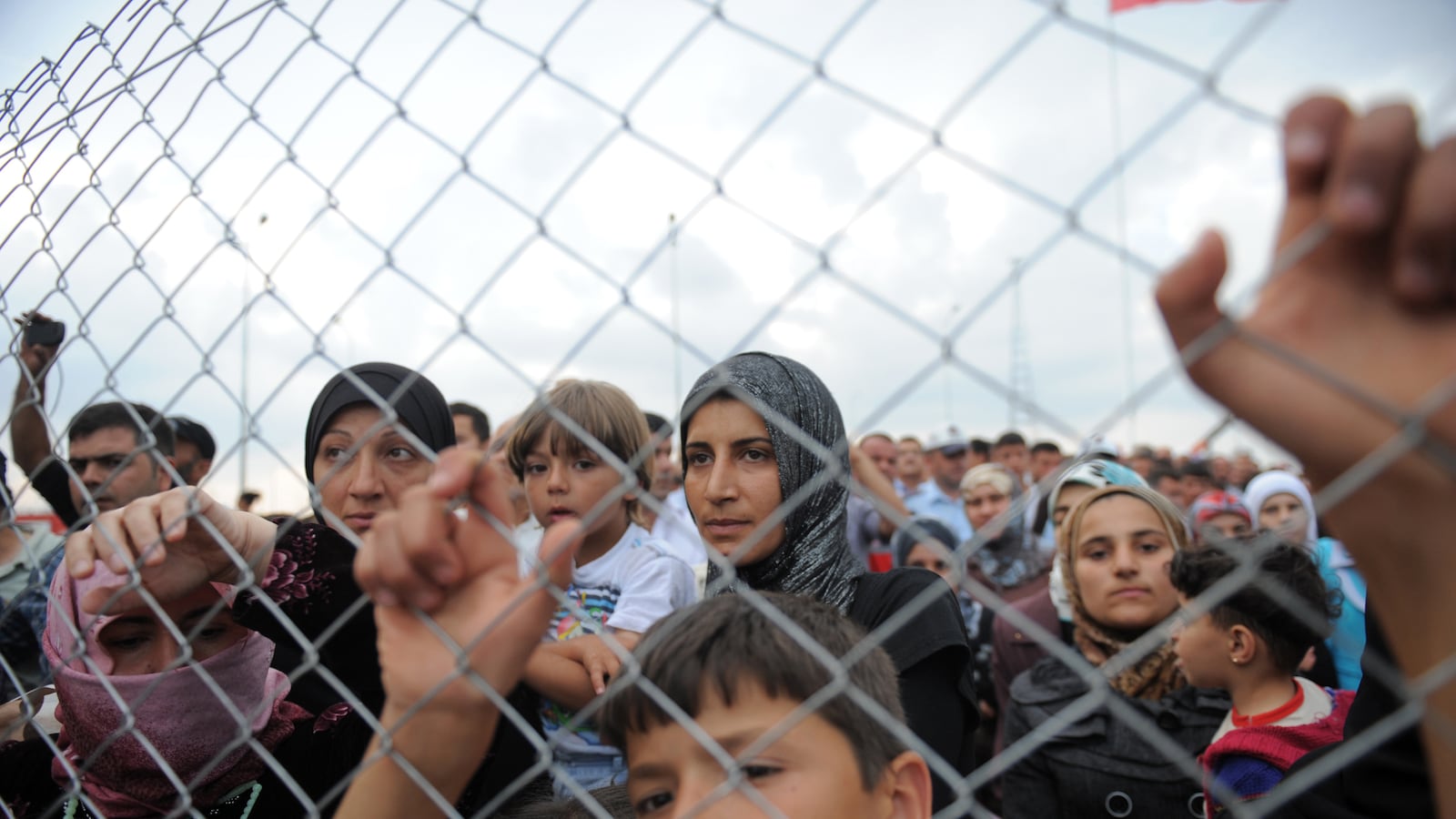 articles/2014/04/14/millions-of-refugees-from-syria-s-war-are-clinging-to-life-in-toxic-conditions/140413-looney-refugee-tease_i1yxn1