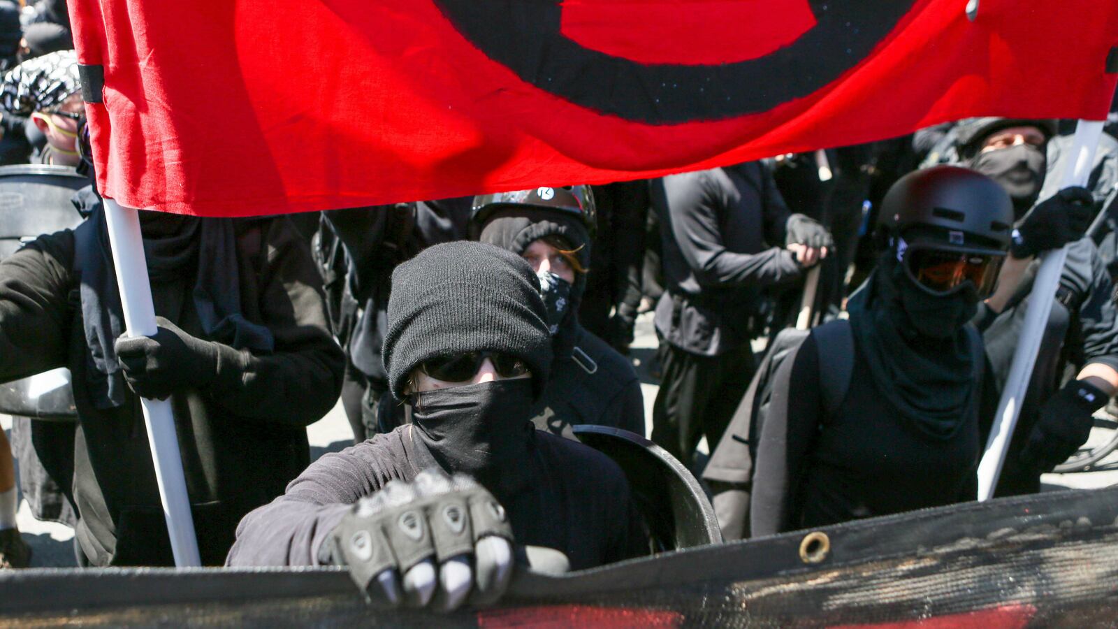 Antifa members and counter protesters gather during a rightwing No-To-Marxism rally on August 27, 2017 at Martin Luther King Jr. Park in Berkeley, California.