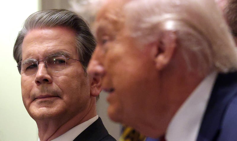 U.S. Treasury Secretary Scott Bessent looks on as U.S. President Donald Trump delivers remarks during a roundtable discussion with farmers in the Cabinet Room of the White House on December 08, 2025 in Washington, DC.