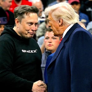 Tesla and SPaceX CEO Elon Musk and US President Donald Trump shake hands